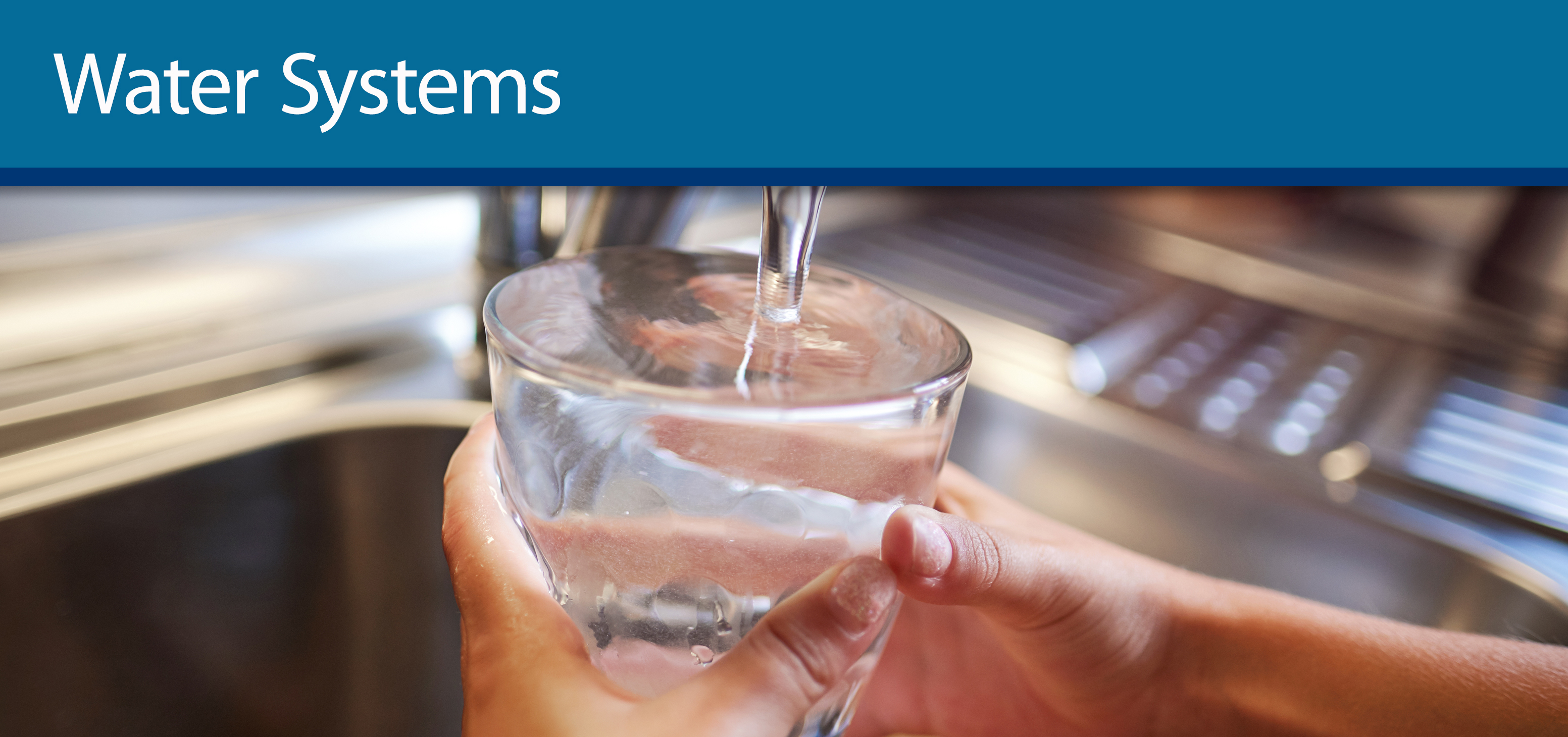 someone filling up water glass from faucet