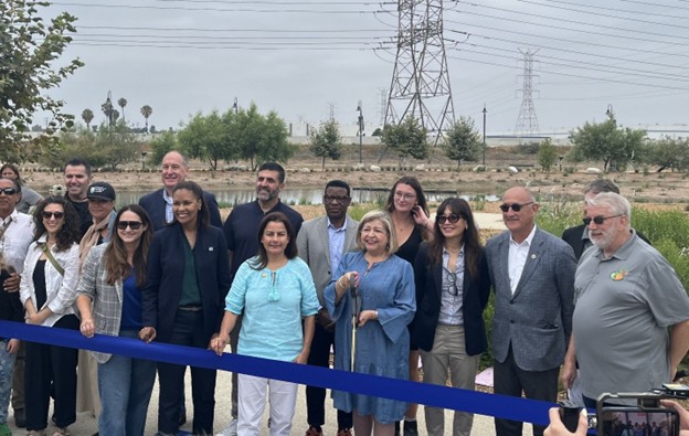 State Water Board Member Nichole Morgan (third from lower left) celebrates the opening of Urban Orchard Park