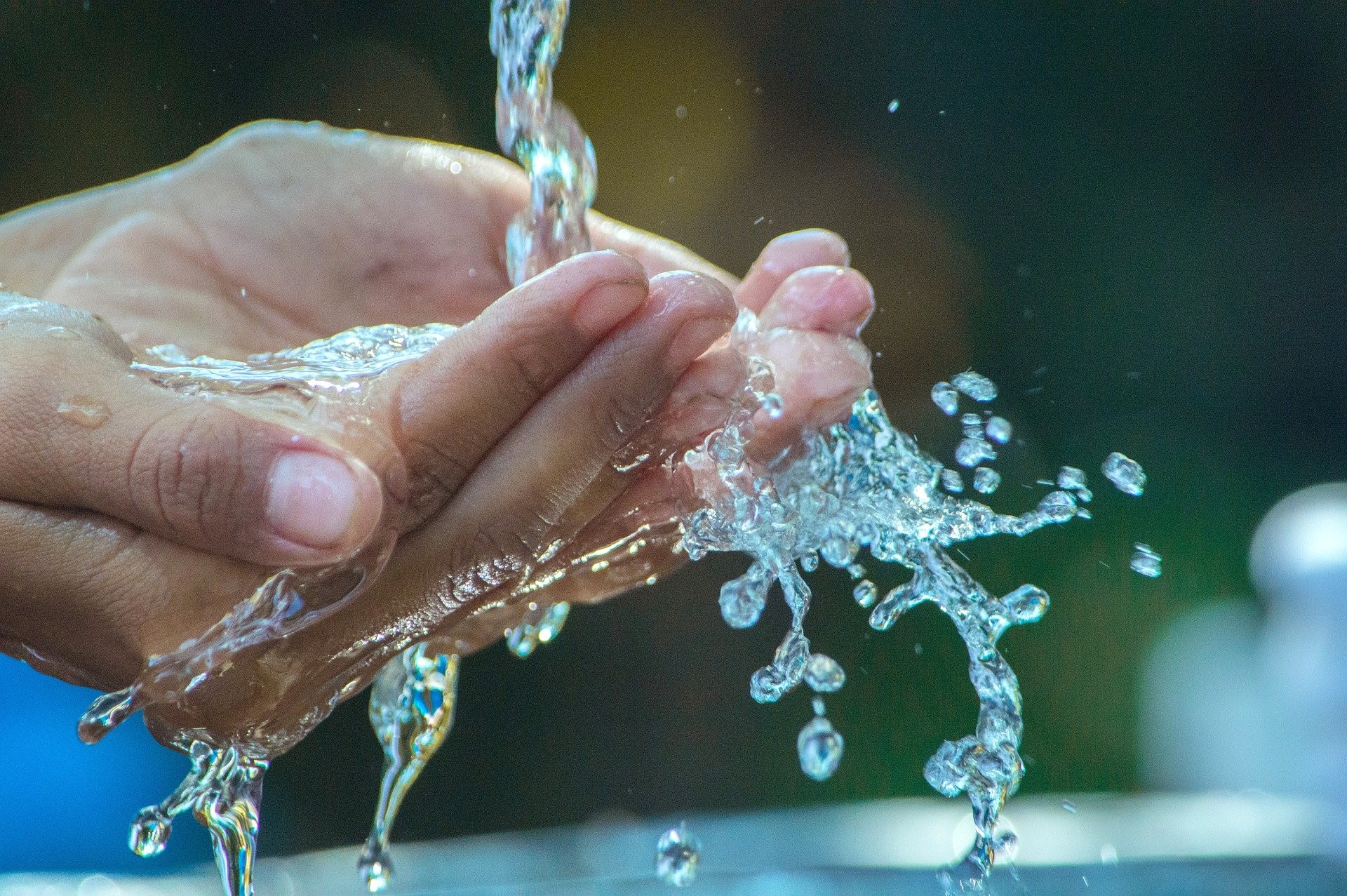 hands catching water
