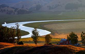 Photo of a meandering Petaluma River in the lower watershed